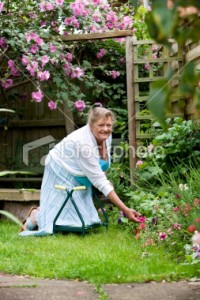 Woman kneeling in garden